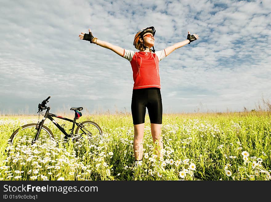 An image of young girl standing in the field. An image of young girl standing in the field