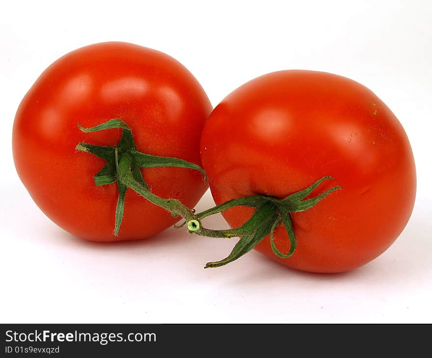 Two tomatoes isolated white background. Two tomatoes isolated white background