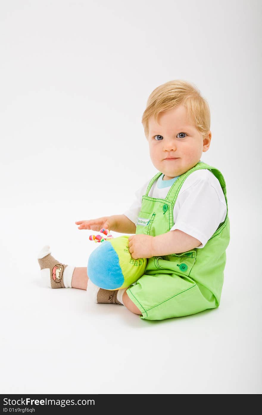 Little baby boy in green a pair of trousers