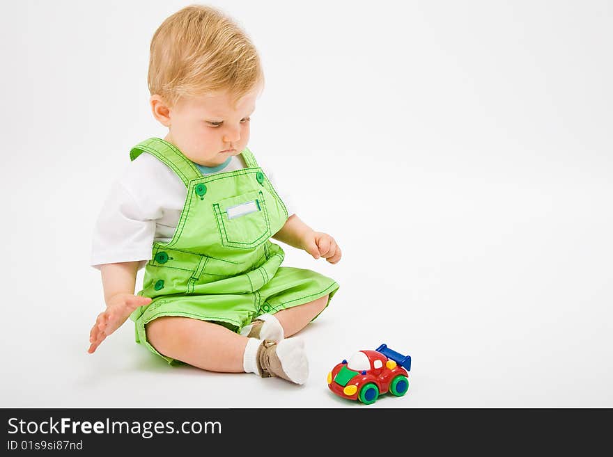 Little baby boy in green a pair of trousers