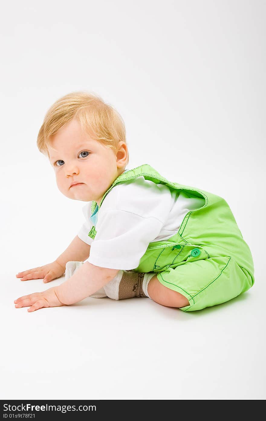 Little baby boy in green a pair of trousers