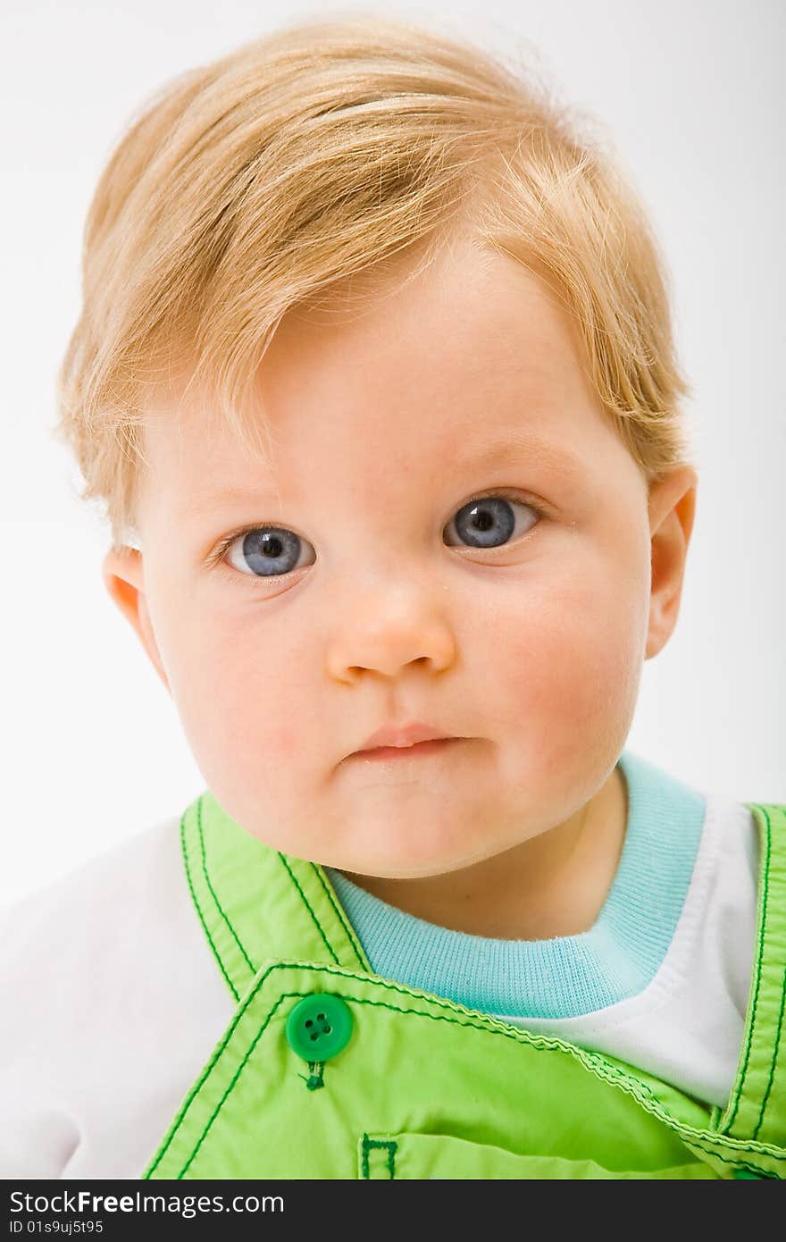 Little baby boy in green a pair of trousers