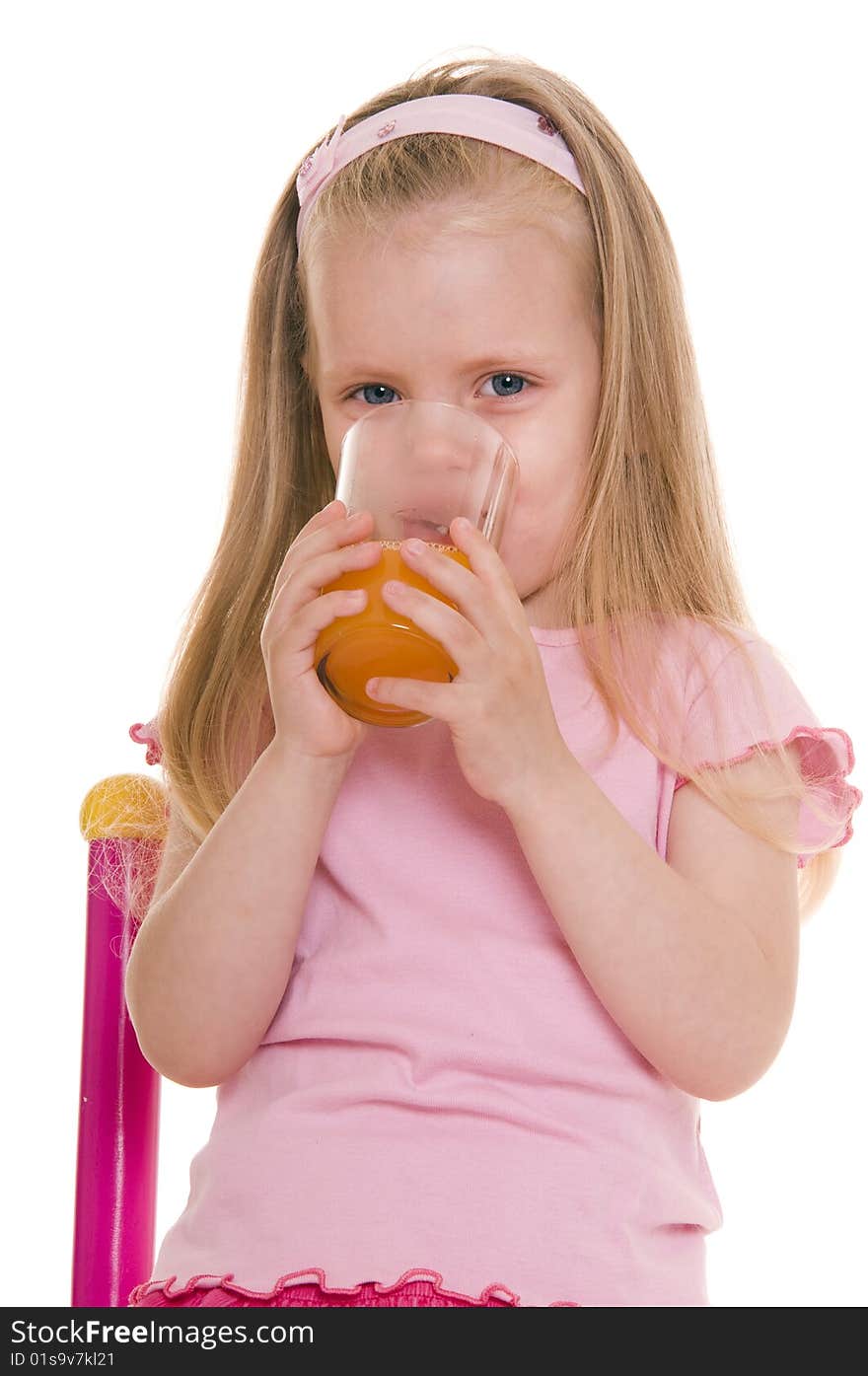 Little girl with glass of juice on white. Little girl with glass of juice on white.