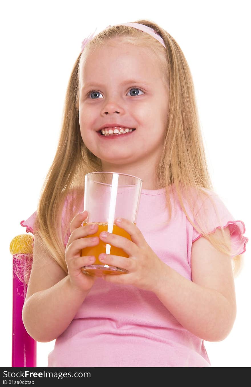 Little girl with glass of juice on white. Little girl with glass of juice on white.