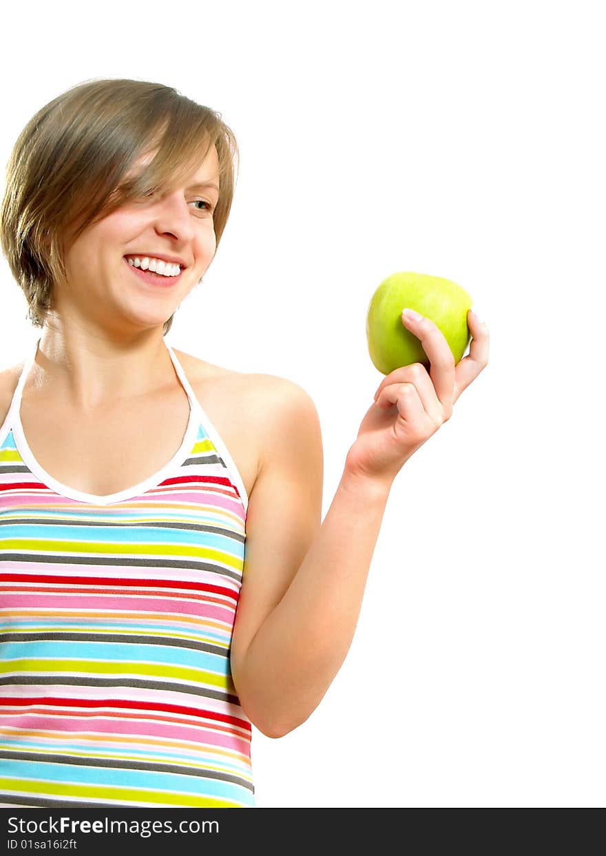 Portrait of a pretty Caucasian blond lady with a nice colorful striped dress who is smiling and she is holding a green apple in her hand. Isolated on white. Portrait of a pretty Caucasian blond lady with a nice colorful striped dress who is smiling and she is holding a green apple in her hand. Isolated on white.