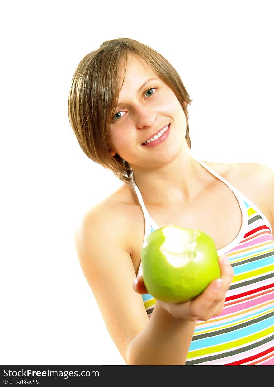 Portrait of an attractive Caucasian blond girl with a nice colorful striped dress who is smiling and she is holding a bitten fresh green apple in her hand. Isolated on white. Portrait of an attractive Caucasian blond girl with a nice colorful striped dress who is smiling and she is holding a bitten fresh green apple in her hand. Isolated on white.