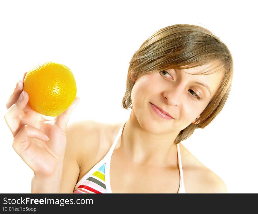 Smiling girl with a fresh orange