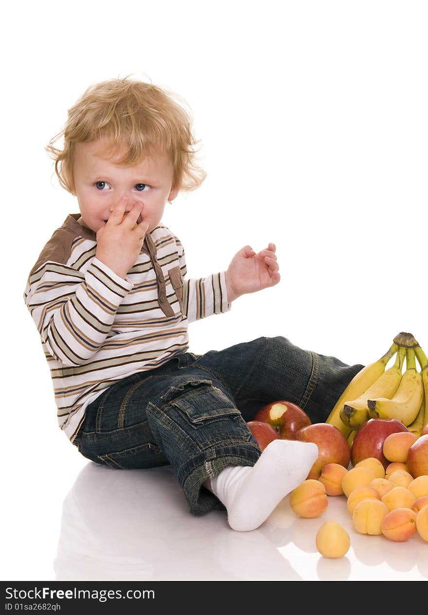 Baby with fruit isolated on white. Baby with fruit isolated on white.