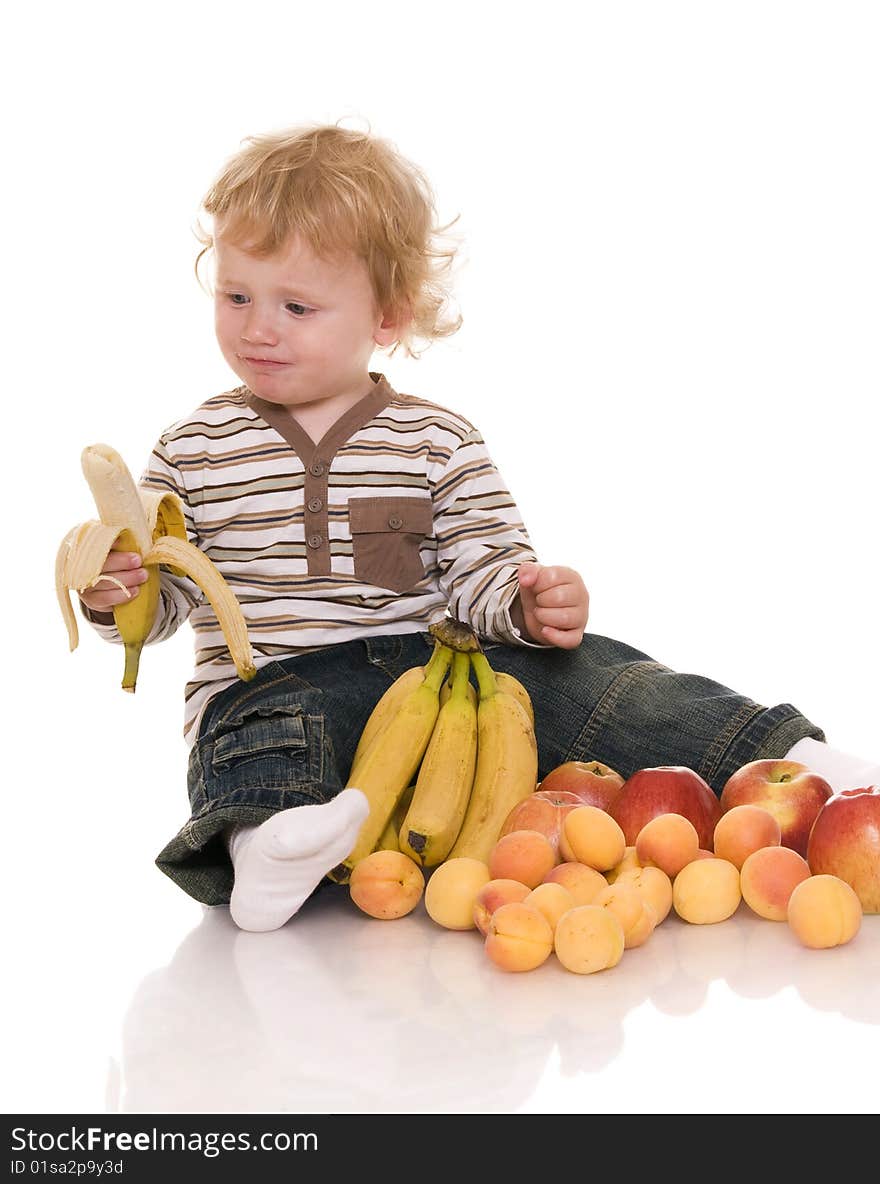 Baby with fruit isolated on white. Baby with fruit isolated on white.