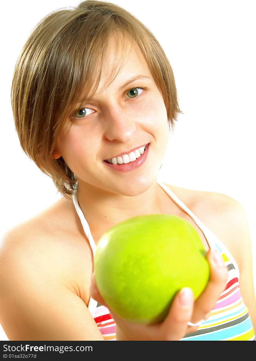 Portrait of an attractive Caucasian blond girl with a nice colorful striped dress who is smiling and she is holding a green apple in her hand. Isolated on white. Portrait of an attractive Caucasian blond girl with a nice colorful striped dress who is smiling and she is holding a green apple in her hand. Isolated on white.