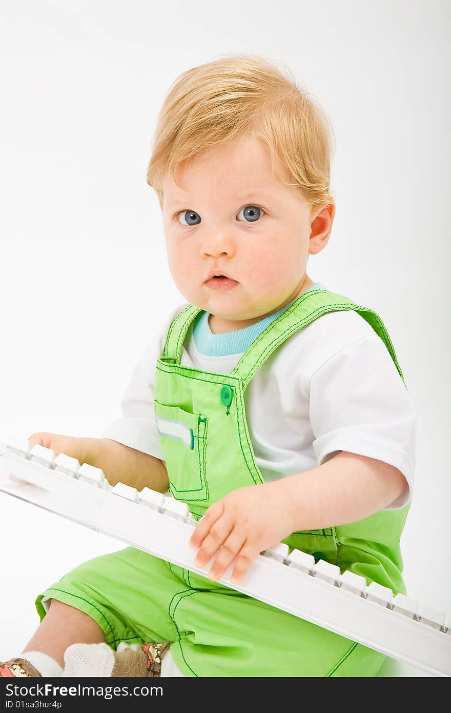 Baby with white keyboard