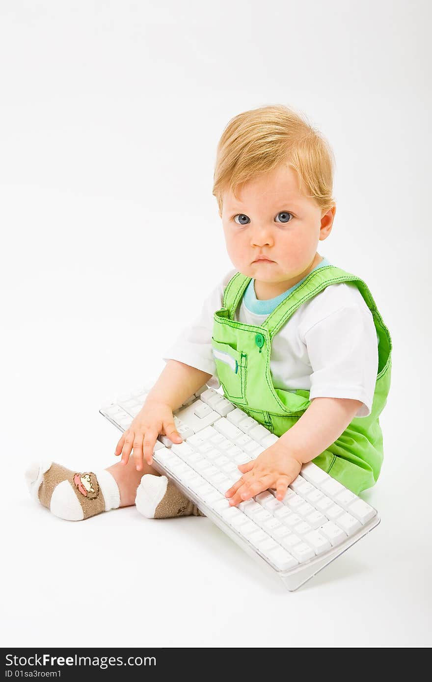 Baby with white keyboard