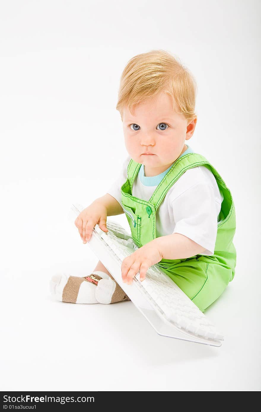 Baby with white keyboard