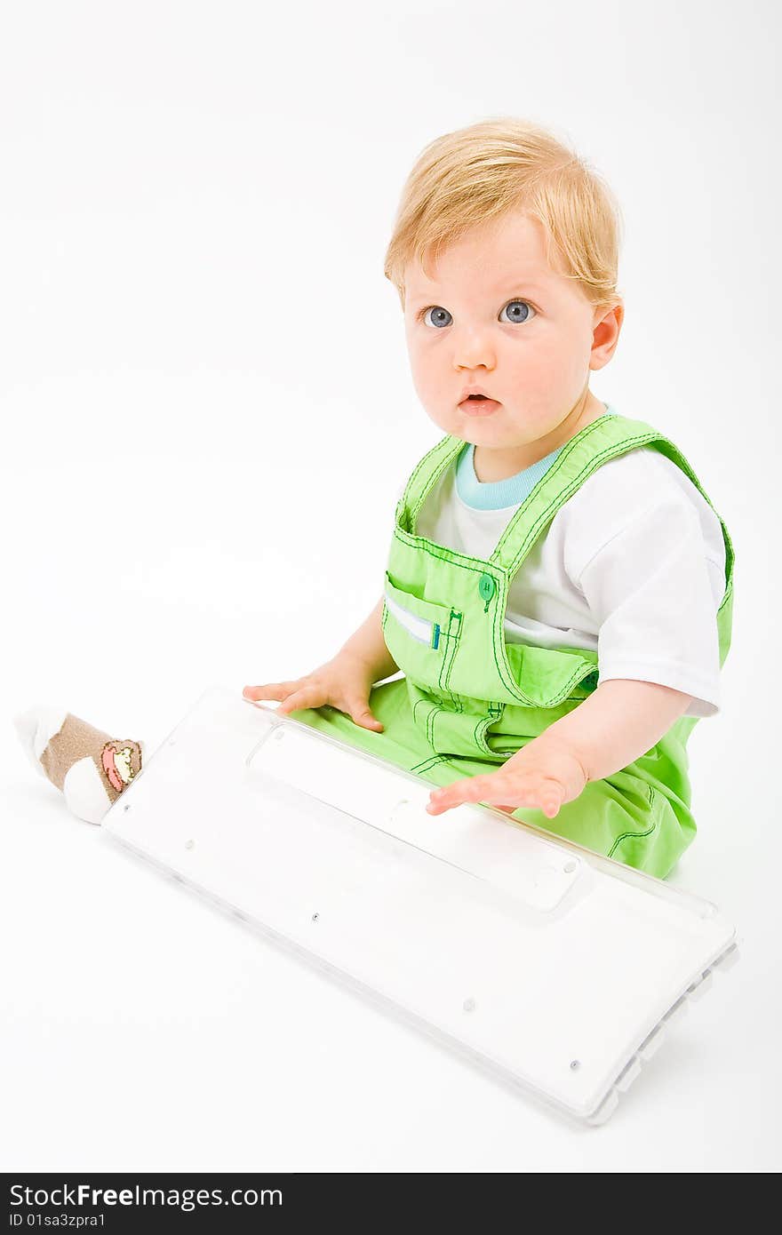 Baby with white keyboard