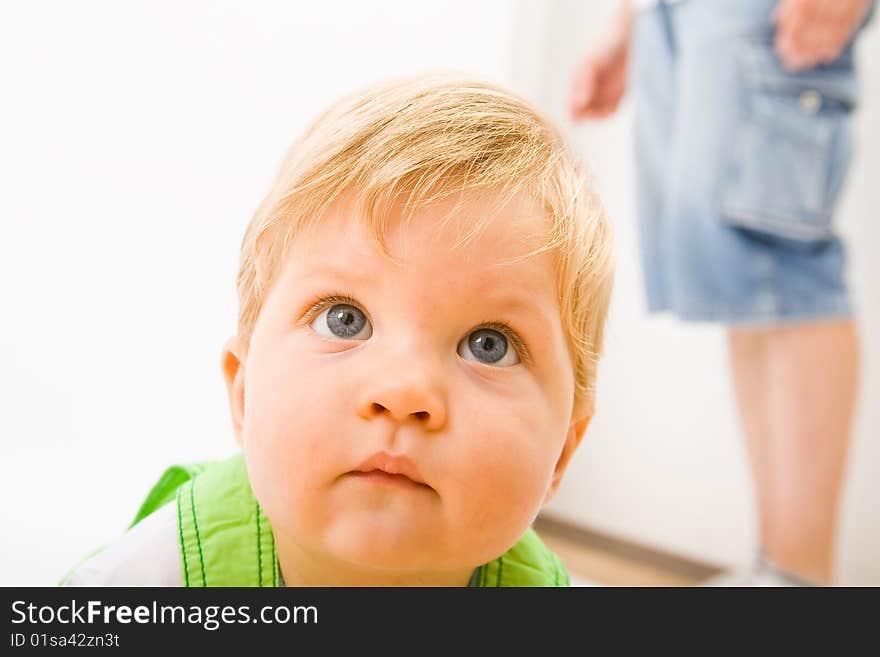 Little baby boy in green a pair of trousers