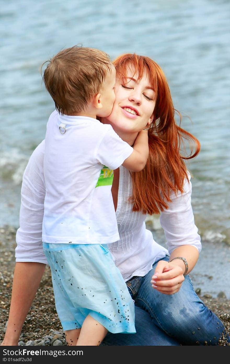 Mother and son playing on beach. Mother and son playing on beach