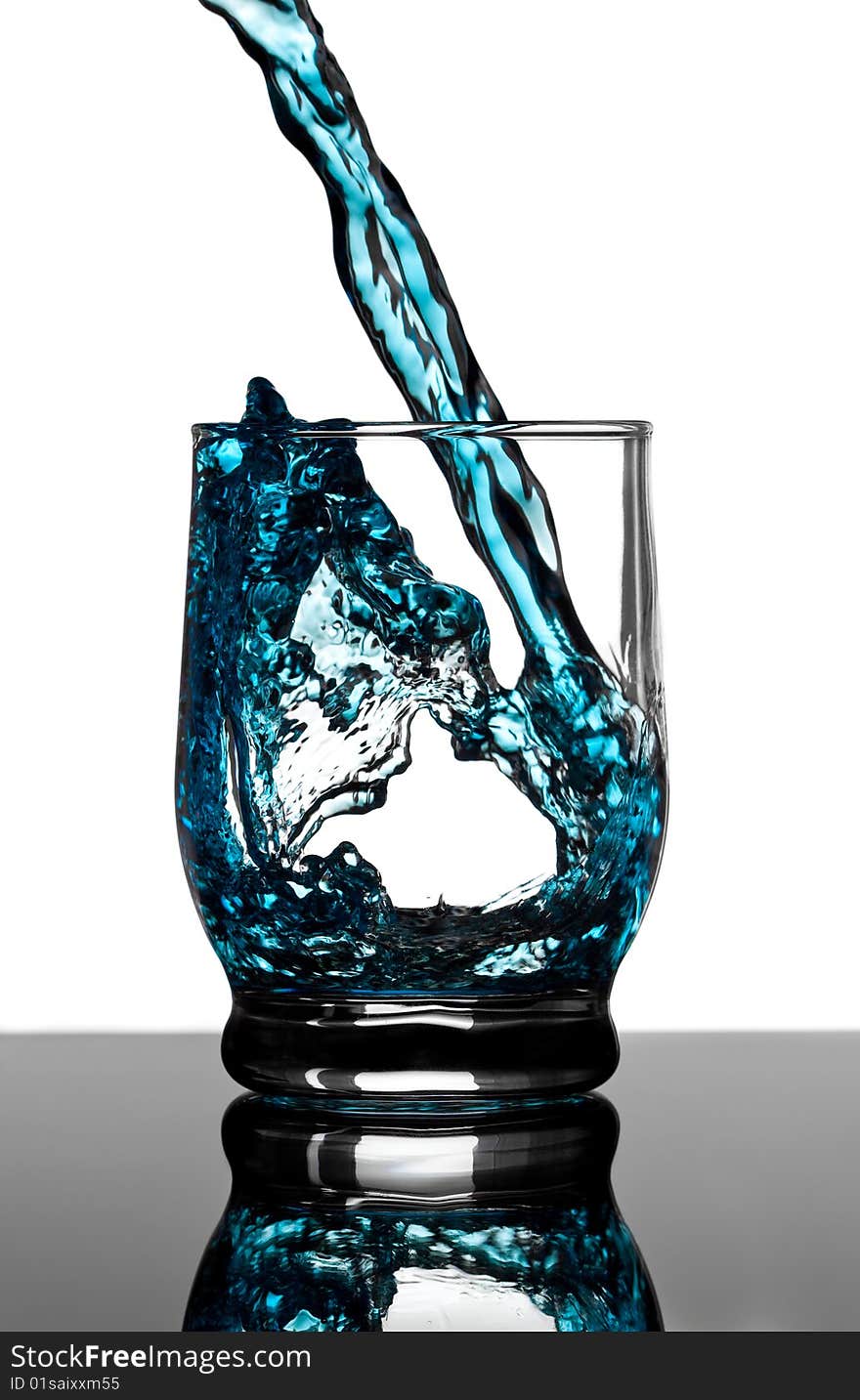 Cold water fills a glass. Cold water fills a glass