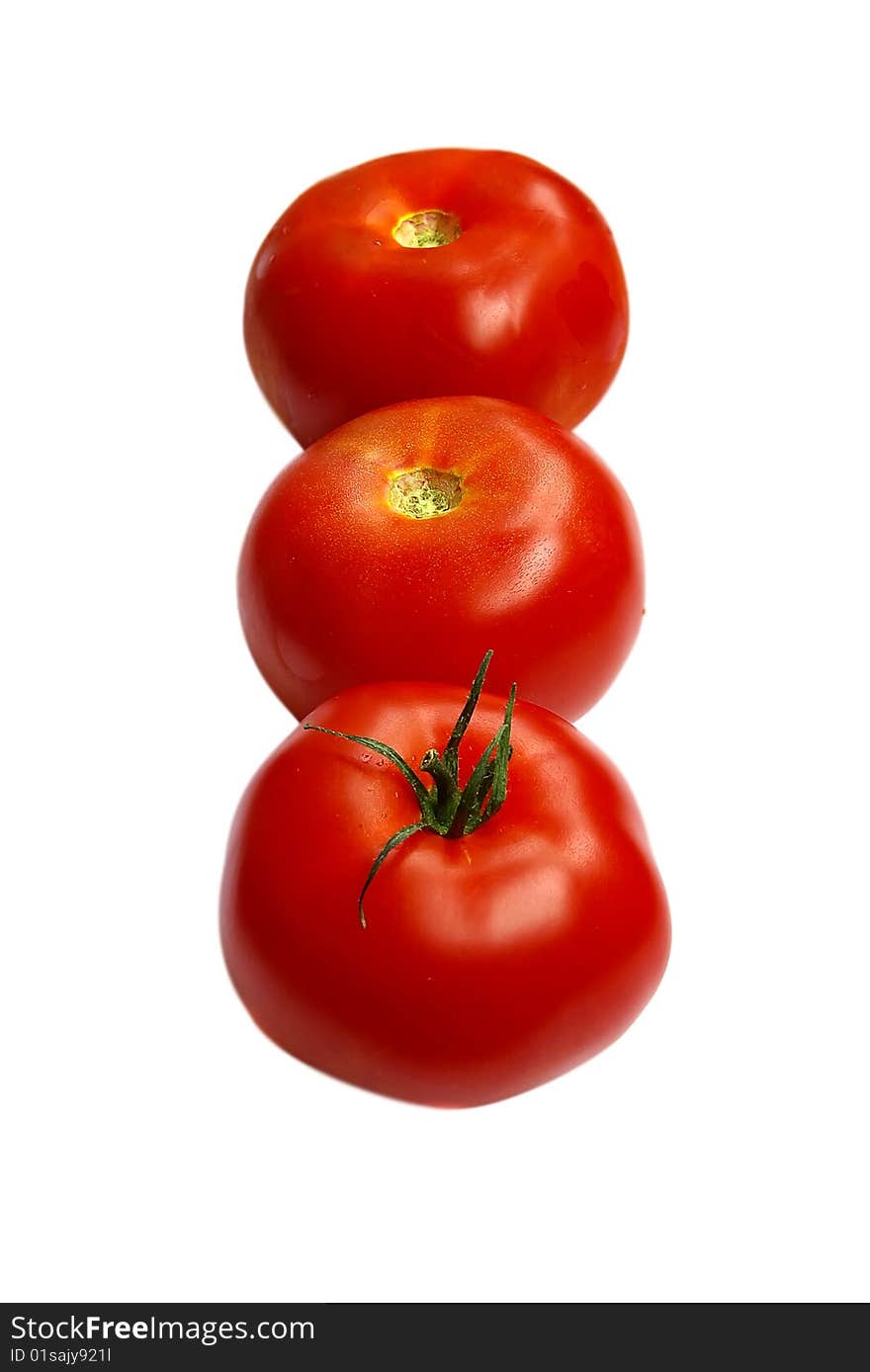 Three fresh tomatoes, isolated on the white. Three fresh tomatoes, isolated on the white