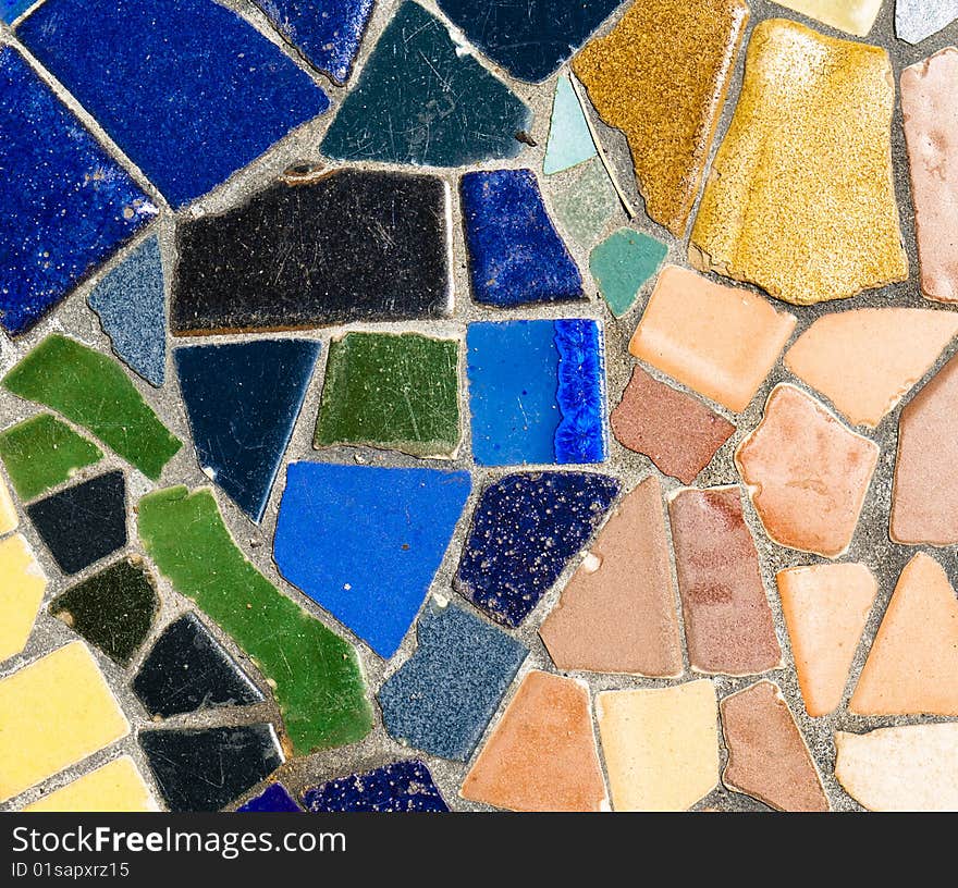 Abstract mosaic pattern with green, blue, and yellow tiles. Abstract mosaic pattern with green, blue, and yellow tiles