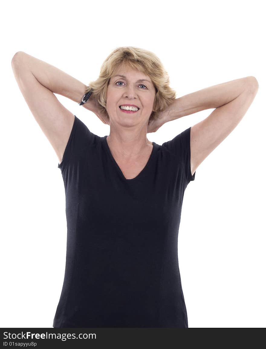 Senior woman doing relaxation exercise with arms behind back. Senior woman doing relaxation exercise with arms behind back.