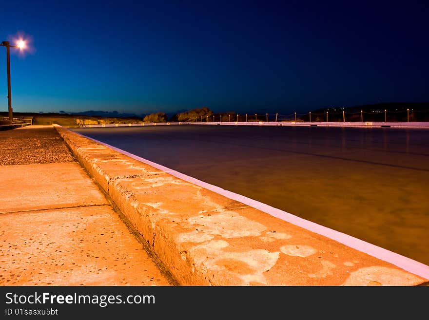 A Beachside Swimming Pool at Dawn