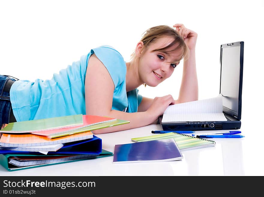 Teenager schoolgirl with laptop on white background