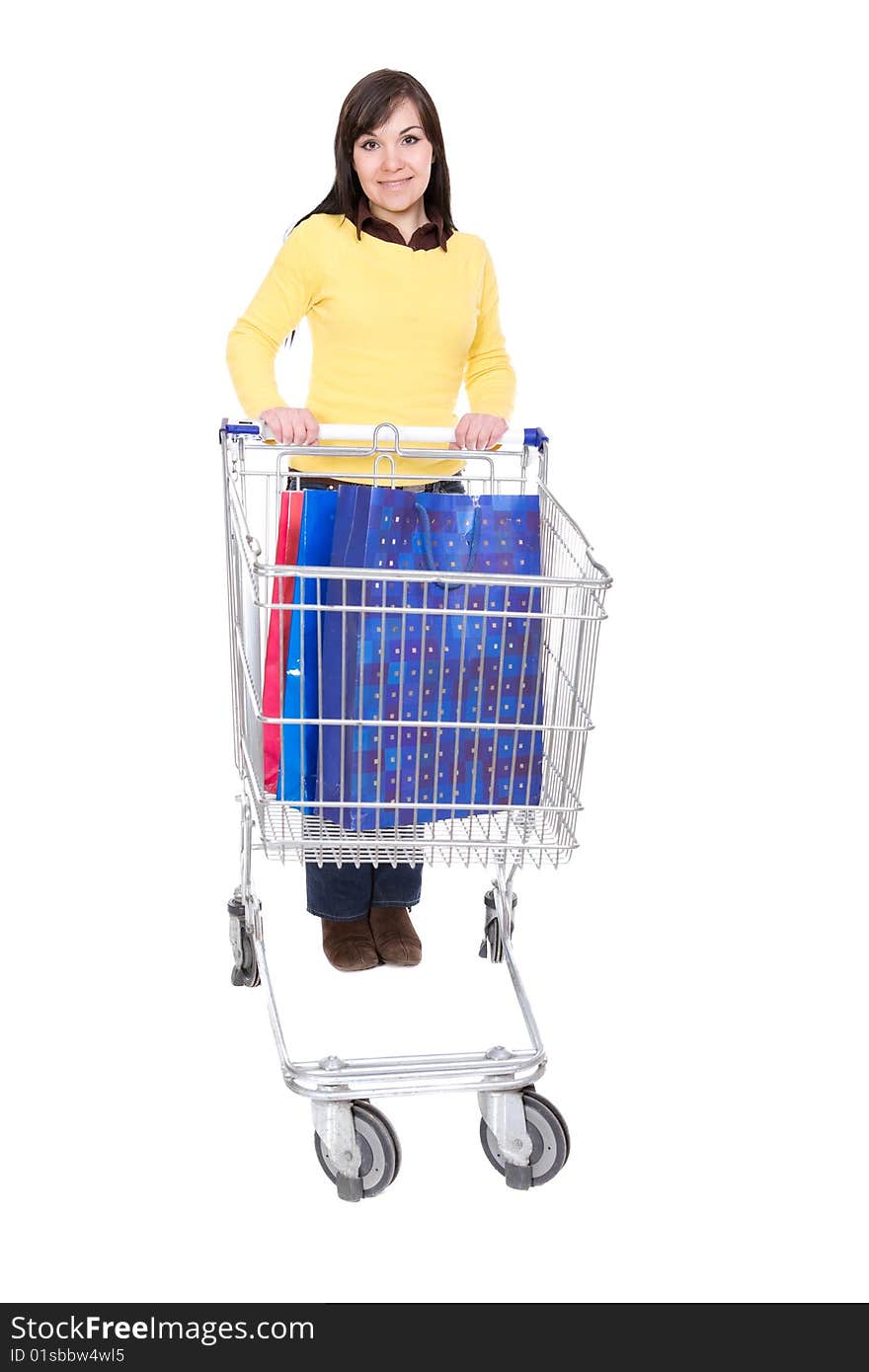 Happy young woman with shopping cart