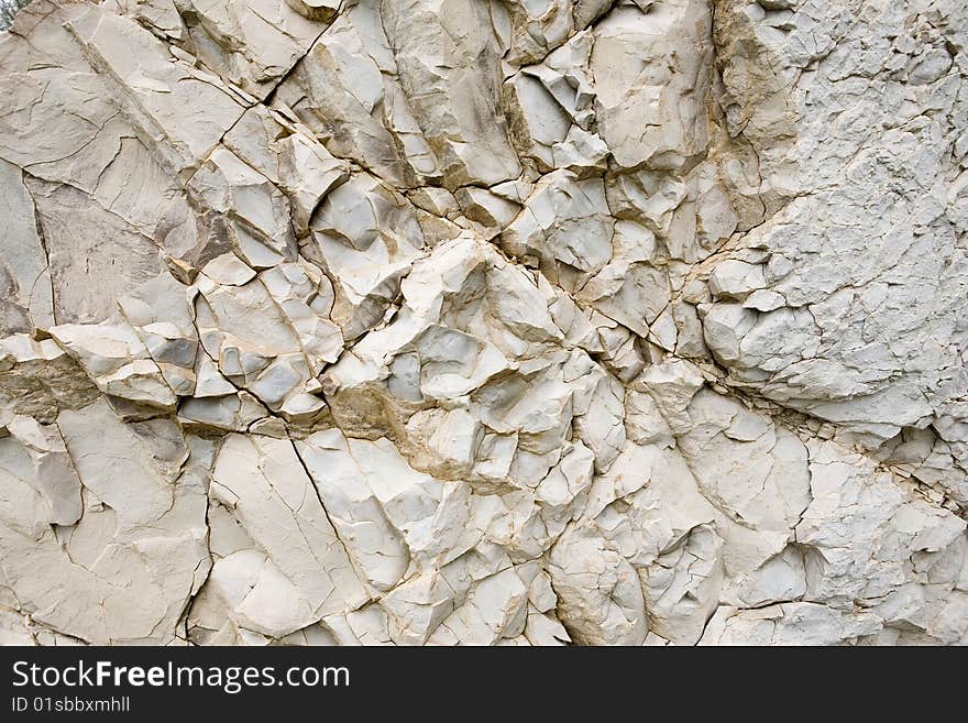 Background of white rocky stone. Background of white rocky stone