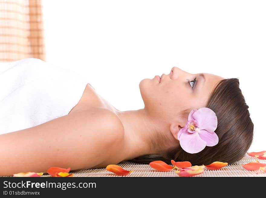 Young woman relaxing in massage. Young woman relaxing in massage