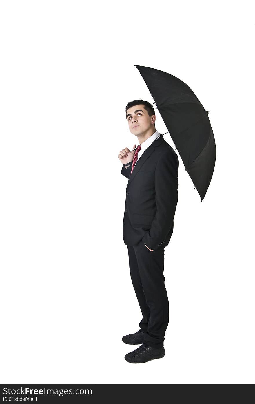 Man in suit walking with black umbrella. Man in suit walking with black umbrella