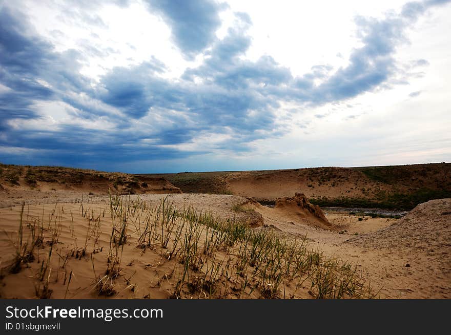 Desert, sky, clouds and sand