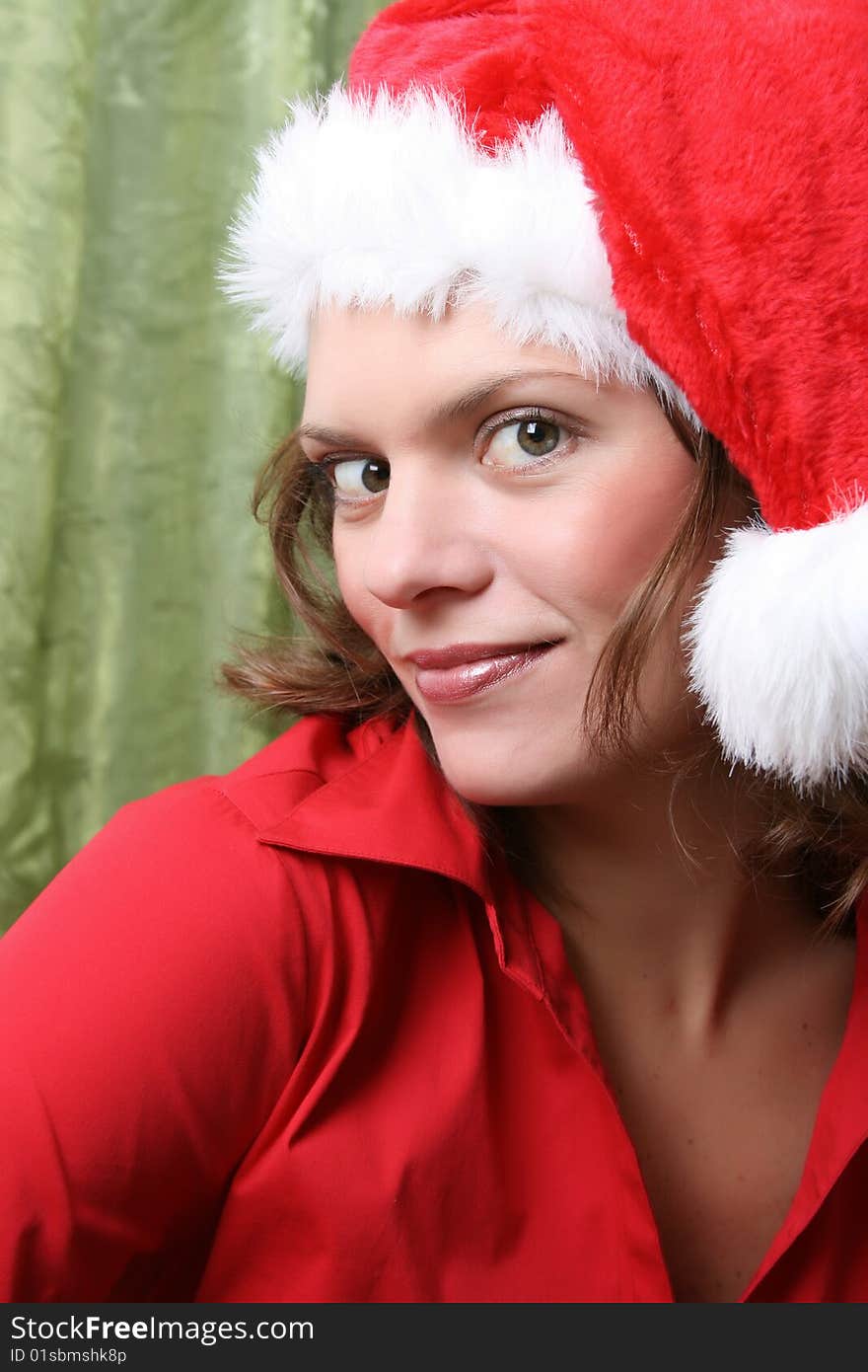 Beautiful Brunette model with a christmas hat and red top. Beautiful Brunette model with a christmas hat and red top