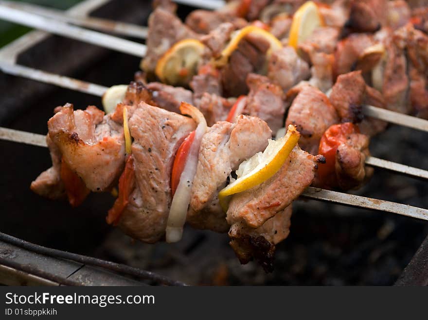 Shish kebab preparation on a brazier.