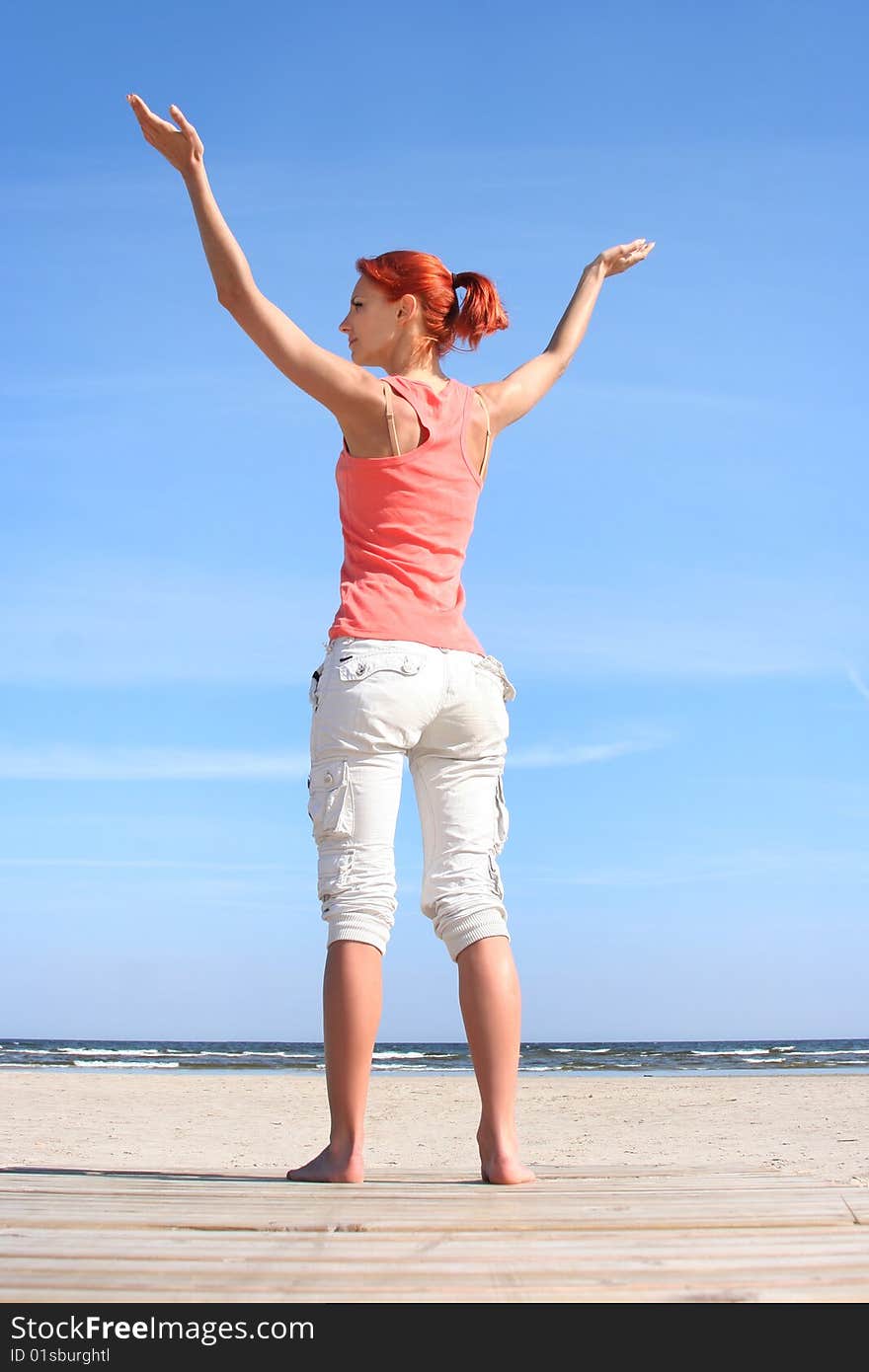 Young woman relaxing onthe beach. Young woman relaxing onthe beach