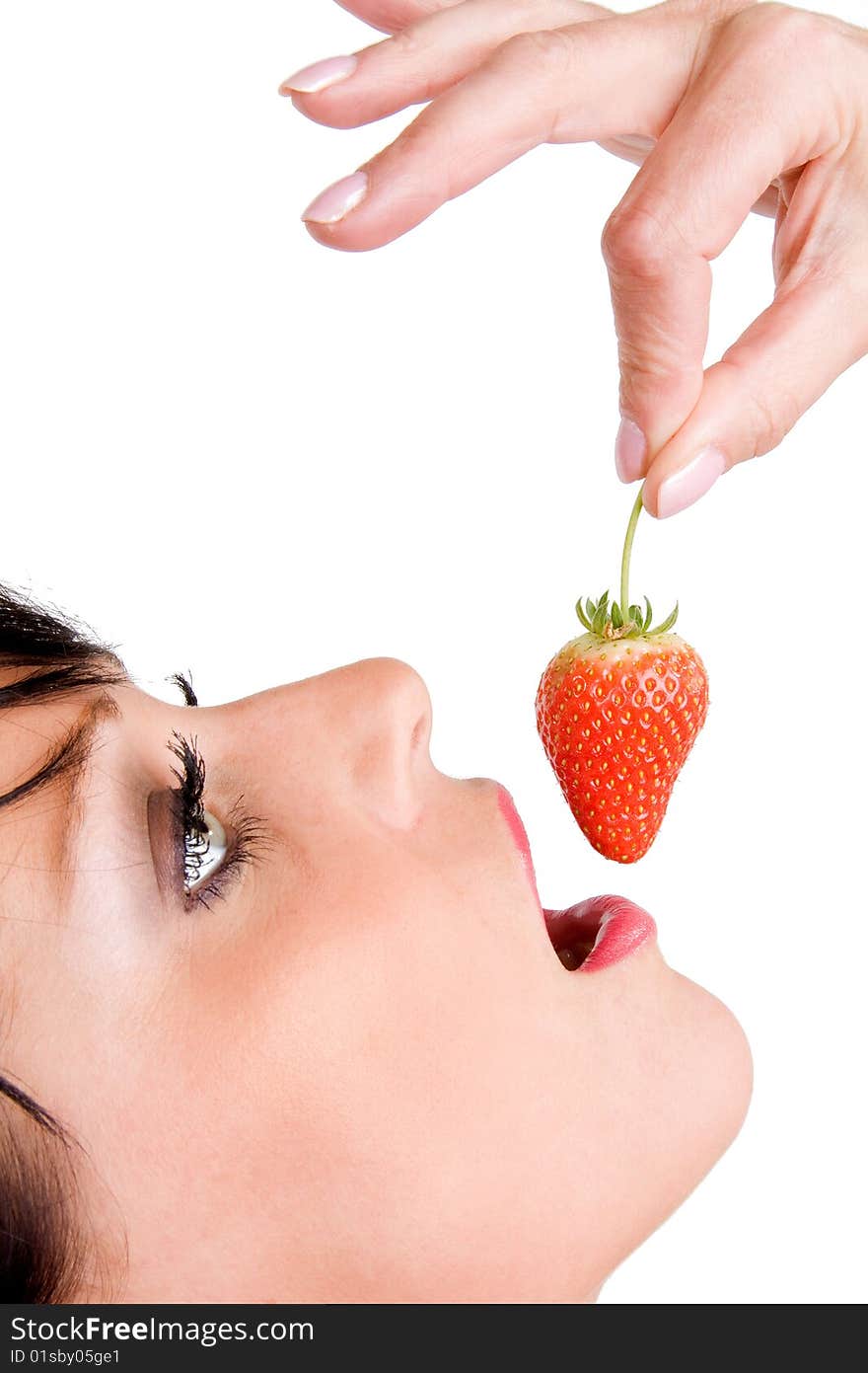 Close up of woman eating a strawberry. Close up of woman eating a strawberry