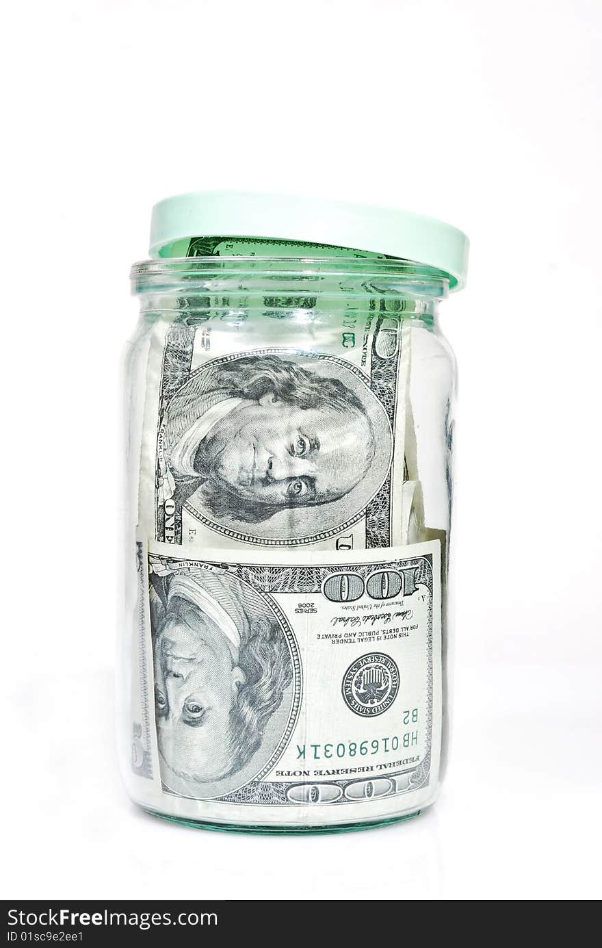 Dollar banknotes in the glass jar