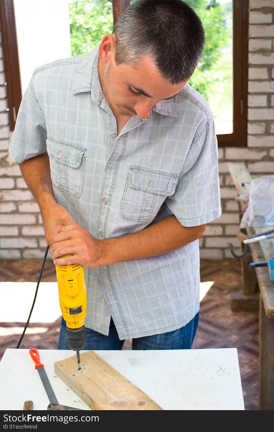 Professional man with drill close-up