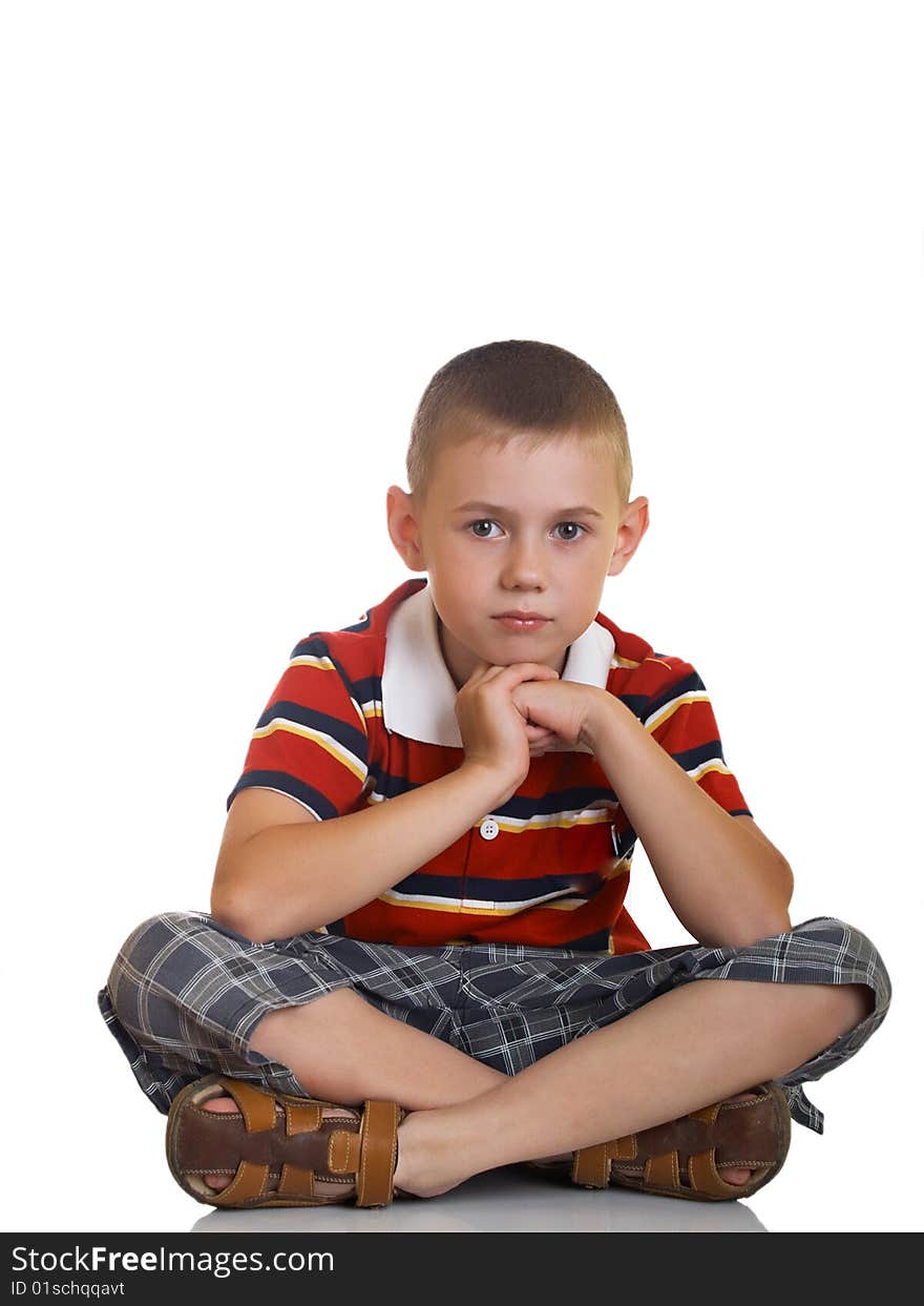 Portrait of the boy sitting on a floor. Portrait of the boy sitting on a floor