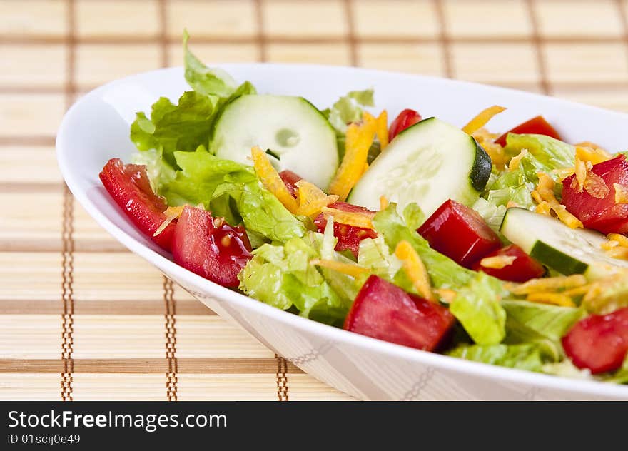 Fresh salad with lettuce tomato and cucumber