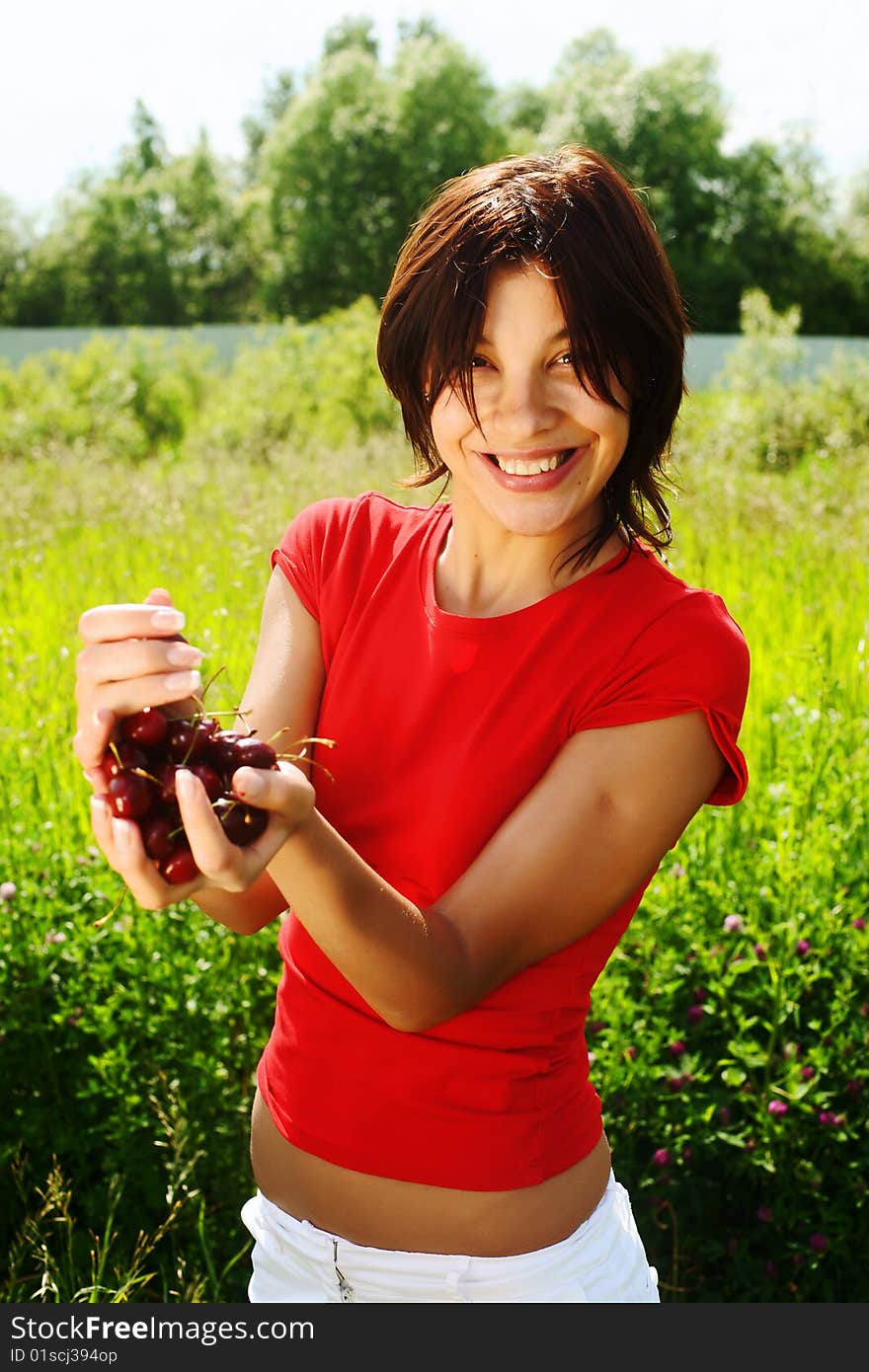 Young Beautiful Girl With Cherries