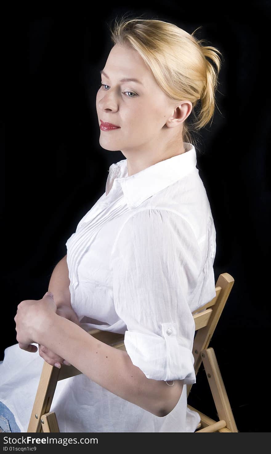 Studio portrait of a beautiful woman with blond hair