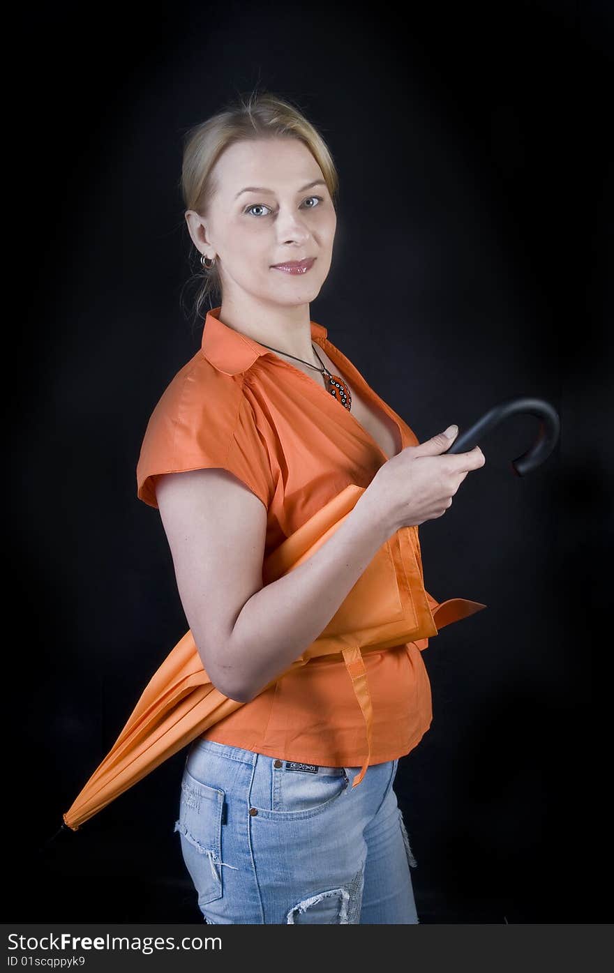 Beautiful lady with umbrella on black background