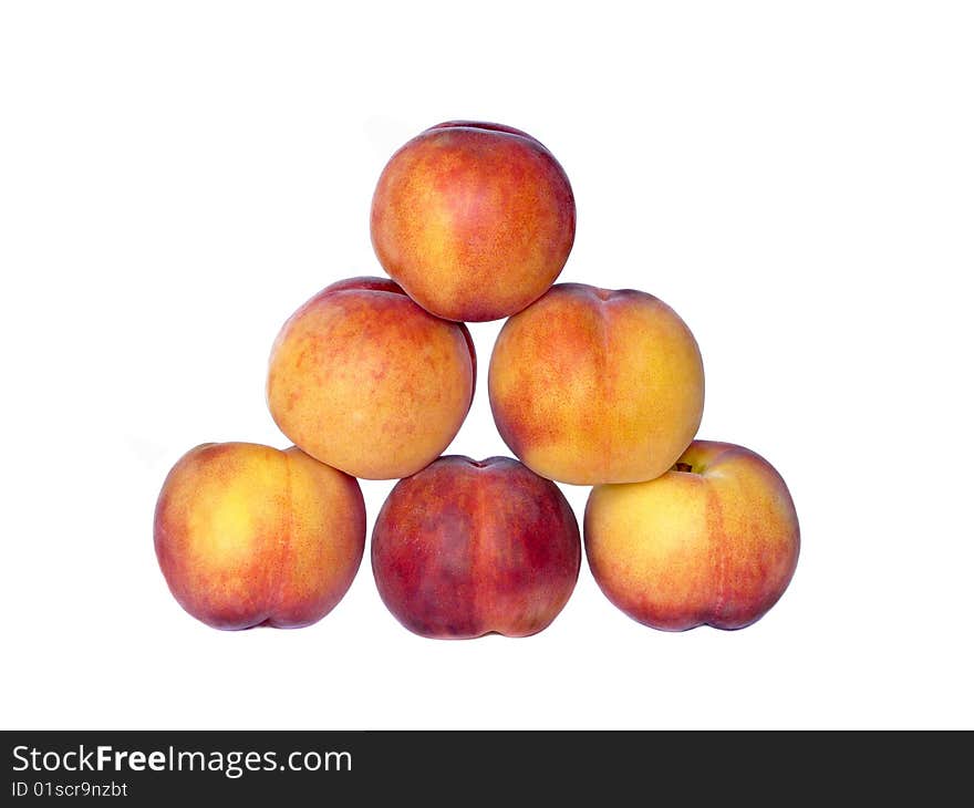 Pyramid from peaches, isolated over white background