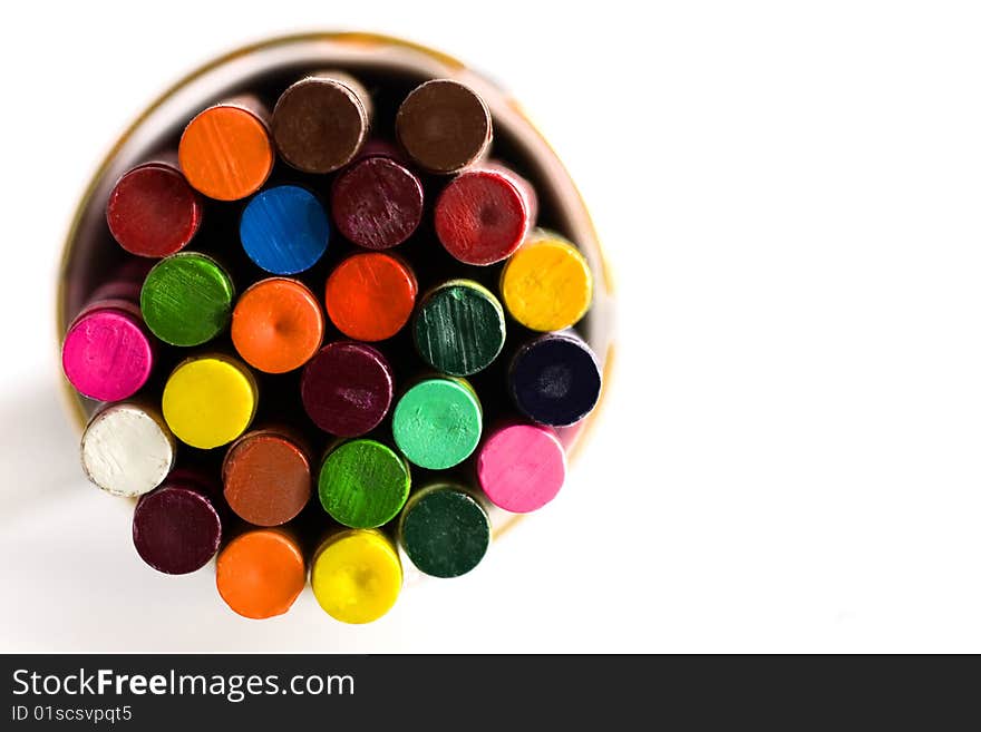 Multicolored crayon bottoms in a cup. Multicolored crayon bottoms in a cup