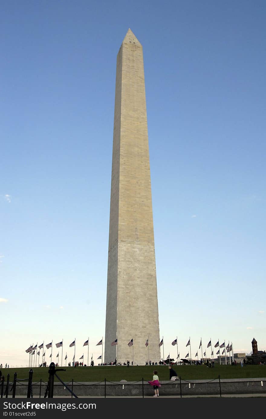 The Washington Monument with flags waving it the breeze. The Washington Monument with flags waving it the breeze