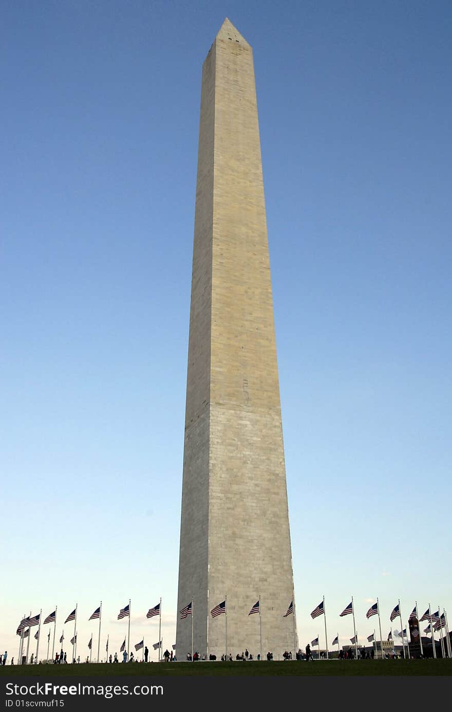 The Washington Monument with flags waving it the breeze. The Washington Monument with flags waving it the breeze