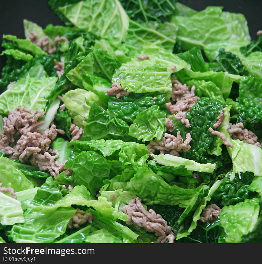 A fresh stew of green cabbage with meat