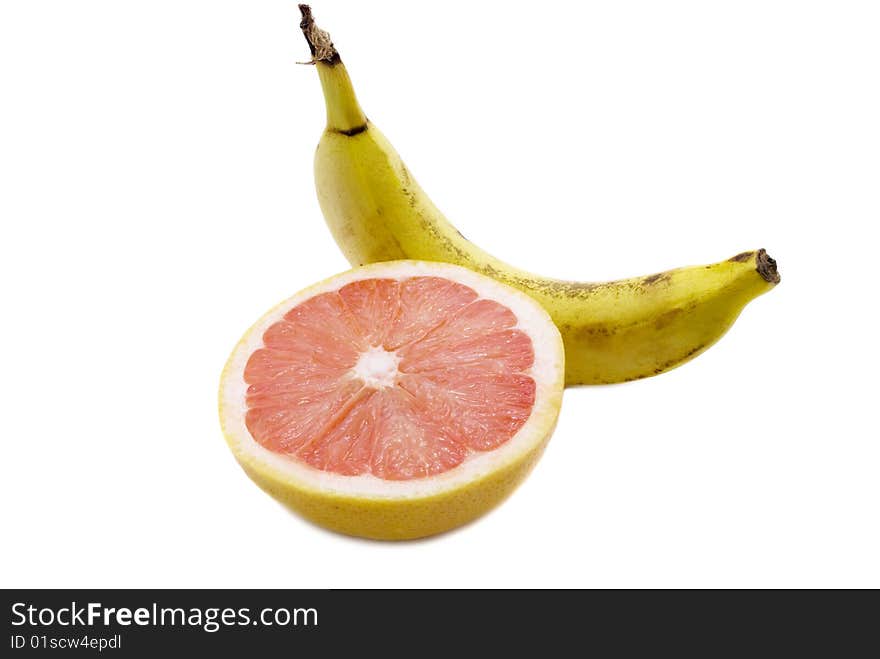 Half of a grapefruit and banana isolated on white. Half of a grapefruit and banana isolated on white