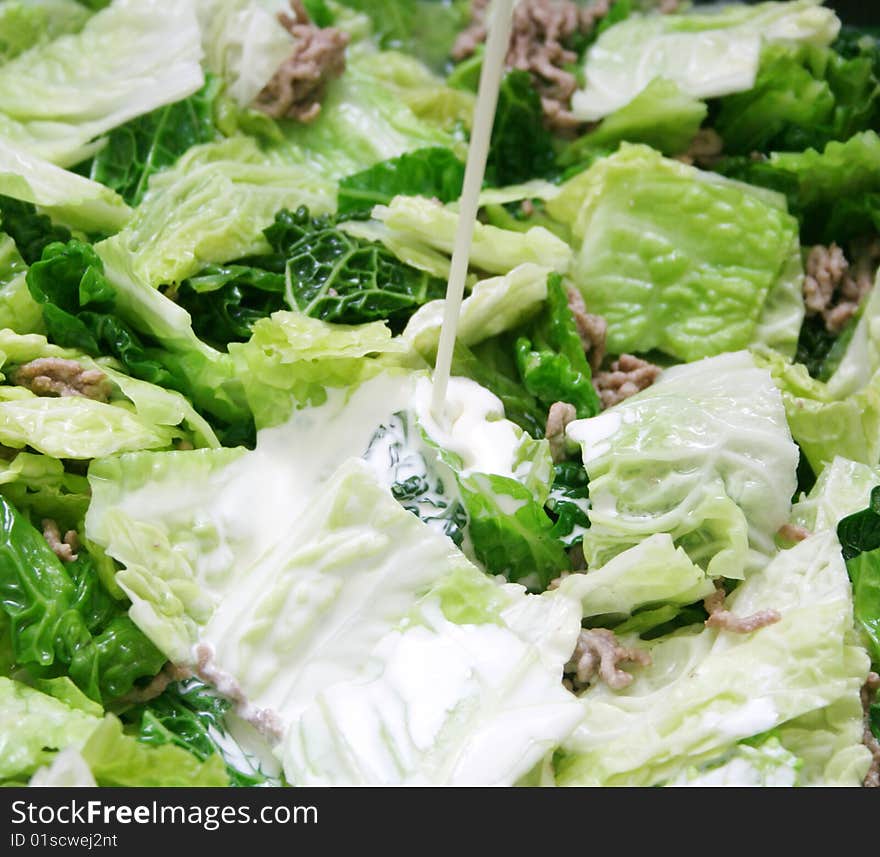 A fresh stew of green cabbage with meat