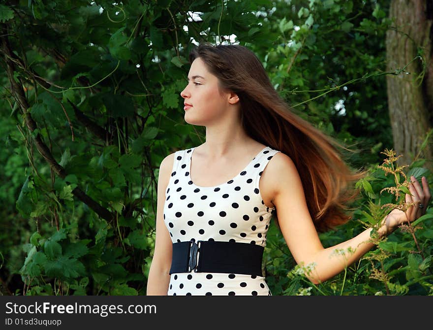 Young girls' portrait in a forest. Young girls' portrait in a forest.